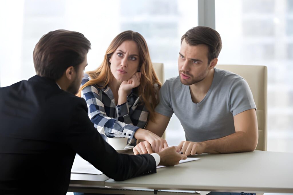 Orlando public adjuster consulting with clients over insurance documents